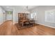 Elegant dining area with hardwood floors, chandelier lighting, and access to a well-lit kitchen at 6900 W Grant Ranch Blvd # 88, Denver, CO 80123
