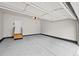 Spacious two car garage with epoxy floors, neutral paint, and an automatic door opener at 6900 W Grant Ranch Blvd # 88, Denver, CO 80123