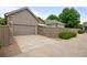 Exterior view of a home featuring a two-car garage with stone accents and a concrete driveway at 6900 W Grant Ranch Blvd # 88, Denver, CO 80123