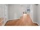 Hallway with hardwood floors leading to kitchen and rooms throughout the house at 6900 W Grant Ranch Blvd # 88, Denver, CO 80123