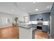 Well-lit kitchen with granite countertops, stainless steel appliances, and open layout at 6900 W Grant Ranch Blvd # 88, Denver, CO 80123
