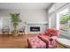 Inviting living room features a marble fireplace, hardwood floors, and charming decor at 6900 W Grant Ranch Blvd # 88, Denver, CO 80123