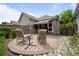Backyard patio with paved bricks, lounge chairs, and landscaping at 6900 W Grant Ranch Blvd # 88, Denver, CO 80123