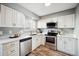 Bright kitchen with stainless steel appliances, white cabinetry, and a modern design at 2105 Coronado Pkwy # C, Denver, CO 80229