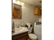 Clean bathroom with washer and dryer, toilet and sink at 17968 E Bethany Pl, Aurora, CO 80013