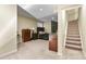 Carpeted basement with dark bedroom set and stairs leading upwards at 5317 W Iliff Dr # 101, Lakewood, CO 80227