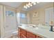 Bathroom with garden tub and shower features white tiling and large mirror at 5317 W Iliff Dr # 101, Lakewood, CO 80227