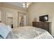 Bedroom features neutral walls, ceiling fan and closet space at 5317 W Iliff Dr # 101, Lakewood, CO 80227