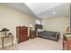 Finished bedroom features neutral walls and carpet, and a queen bed at 5317 W Iliff Dr # 101, Lakewood, CO 80227