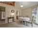 Cozy dining area with a round table, classic chandelier, and view of the kitchen at 5317 W Iliff Dr # 101, Lakewood, CO 80227