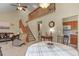 Inviting living area featuring a staircase, dining space, and comfortable seating at 5317 W Iliff Dr # 101, Lakewood, CO 80227