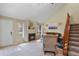 Bright living room featuring a fireplace, vaulted ceilings, and natural light at 5317 W Iliff Dr # 101, Lakewood, CO 80227
