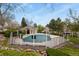 Community swimming pool with fencing and seating at 5317 W Iliff Dr # 101, Lakewood, CO 80227
