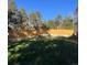 Large, grassy backyard featuring a wooden fence, offering privacy and space for outdoor activities at 34480 County Road 17, Elizabeth, CO 80107
