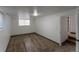 Carpeted basement featuring neutral walls, window and access door at 34480 County Road 17, Elizabeth, CO 80107