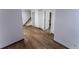 Spacious basement living area features hardwood floors, utility access, and white walls at 34480 County Road 17, Elizabeth, CO 80107