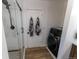 Modern bathroom featuring a glass shower and convenient washer and dryer at 34480 County Road 17, Elizabeth, CO 80107