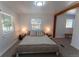 Bedroom with neutral carpet, comfortable bed, two windows and reading lamps at 34480 County Road 17, Elizabeth, CO 80107