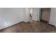 Cozy bedroom showcasing plush carpet, neutral walls, base trim, and open closet at 34480 County Road 17, Elizabeth, CO 80107