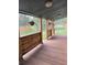 Charming covered porch with beautiful hanging flower baskets at 34480 County Road 17, Elizabeth, CO 80107