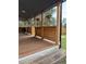 Covered porch features wood beams and plank railings at 34480 County Road 17, Elizabeth, CO 80107