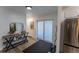 Bright entryway with modern console table, mirror, and sliding glass door to the outside patio at 34480 County Road 17, Elizabeth, CO 80107