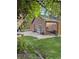 Brick home exterior with lush, green lawn and stone patio at 34480 County Road 17, Elizabeth, CO 80107