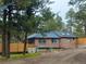 Brick home featuring modern updates, including newer roof with skylights and an updated fence for added privacy at 34480 County Road 17, Elizabeth, CO 80107
