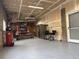 Spacious garage, featuring an epoxy floor, equipment, and storage space at 34480 County Road 17, Elizabeth, CO 80107