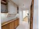 Hallway with wood cabinets and shelves, showcasing stylish design and plenty of storage at 34480 County Road 17, Elizabeth, CO 80107