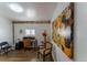 Well-lit office featuring hardwood floors, a functional desk, and colorful art on the wall at 34480 County Road 17, Elizabeth, CO 80107