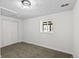 Bright, clean basement room with neutral carpeting and double doors at 3530 W Edgemore Pl, Englewood, CO 80110