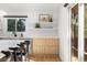 Modern kitchen with white quartz countertops and light wood cabinets at 6949 S Sheridan Blvd, Littleton, CO 80128