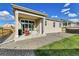 Well-maintained backyard featuring a covered patio, gravel landscaping, and a small section of lush green grass at 27862 E 9Th Dr, Aurora, CO 80018
