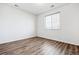 Clean, empty bedroom with a window and hardwood floors, ready for customization at 27862 E 9Th Dr, Aurora, CO 80018