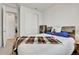 Bedroom featuring carpet, a wood bed frame, and closet at 27862 E 9Th Dr, Aurora, CO 80018