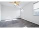 Bright bedroom featuring two windows, ceiling fan and carpet at 27862 E 9Th Dr, Aurora, CO 80018
