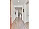 Bright entryway with hardwood floors, offering a welcoming view into the home's open layout at 27862 E 9Th Dr, Aurora, CO 80018