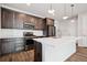Well-equipped kitchen with stainless steel appliances, stylish cabinets, and a bright island at 27862 E 9Th Dr, Aurora, CO 80018