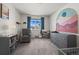 Bedroom with gray dresser and rocking chair at 12886 Jasmine St # B, Thornton, CO 80602