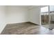 Dining room with new floors and sliding glass doors to the backyard at 13015 W Ohio Ave, Lakewood, CO 80228