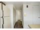 Hallway to the living room with storage and new floors at 13015 W Ohio Ave, Lakewood, CO 80228