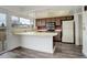 Cozy kitchen with breakfast bar, natural light and modern floors at 13015 W Ohio Ave, Lakewood, CO 80228