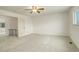 Empty main bedroom featuring a ceiling fan, a window, and neutral carpeting at 13015 W Ohio Ave, Lakewood, CO 80228