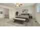 Staged main bedroom with a ceiling fan, rug, and a comfortable king-size bed at 13015 W Ohio Ave, Lakewood, CO 80228