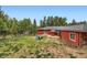 A view of the backyard featuring an outdoor seating area and home at 4776 Red Rock Dr, Larkspur, CO 80118