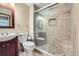 Well-maintained bathroom with tiled shower featuring a glass door and built-in seat at 4776 Red Rock Dr, Larkspur, CO 80118