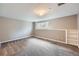 This bedroom offers soft, neutral colors, carpet, and built-in shelves at 4776 Red Rock Dr, Larkspur, CO 80118