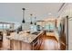 Bright, open kitchen with granite island, stainless steel appliances, and hardwood floors at 4776 Red Rock Dr, Larkspur, CO 80118