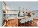 Spacious kitchen featuring a large island, stainless steel appliances, and modern finishes at 4776 Red Rock Dr, Larkspur, CO 80118